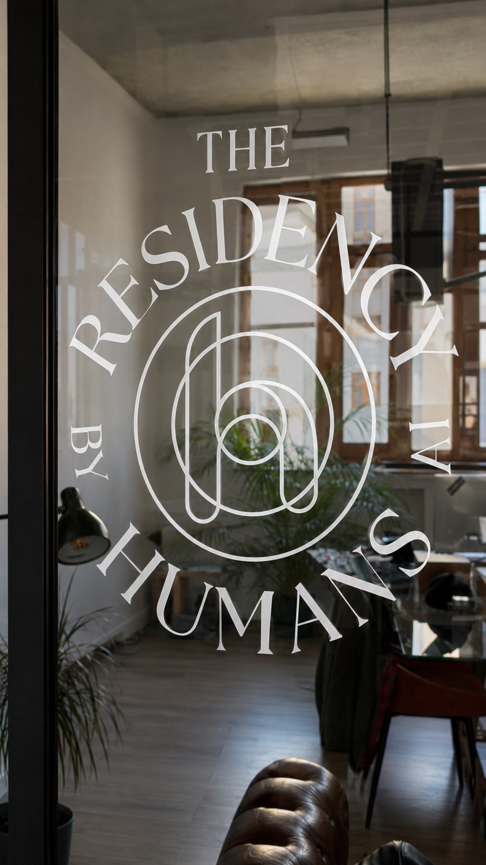 The Residency seal etched on the office glass door